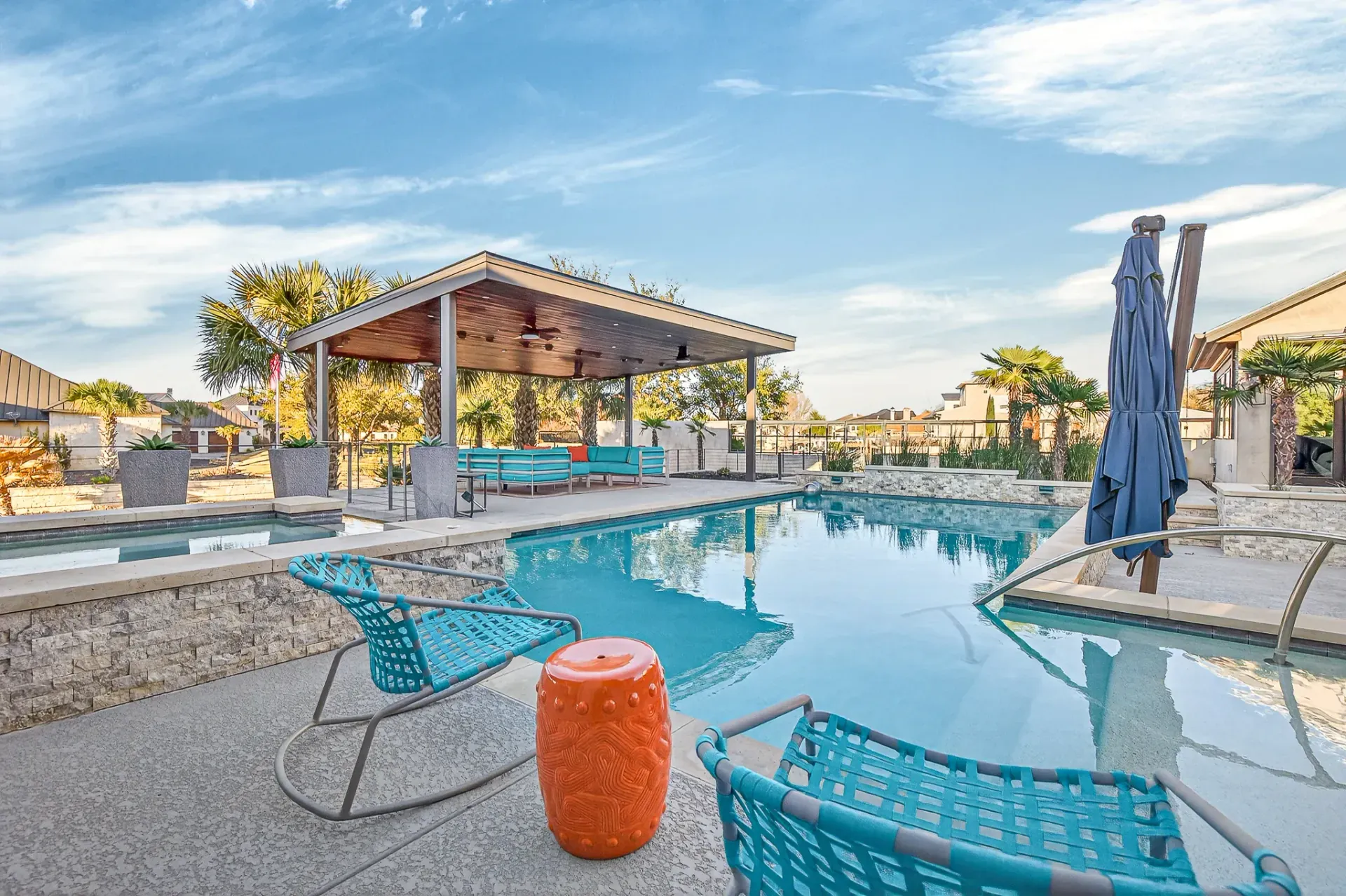 Pool with covered cabana and lounge chairs